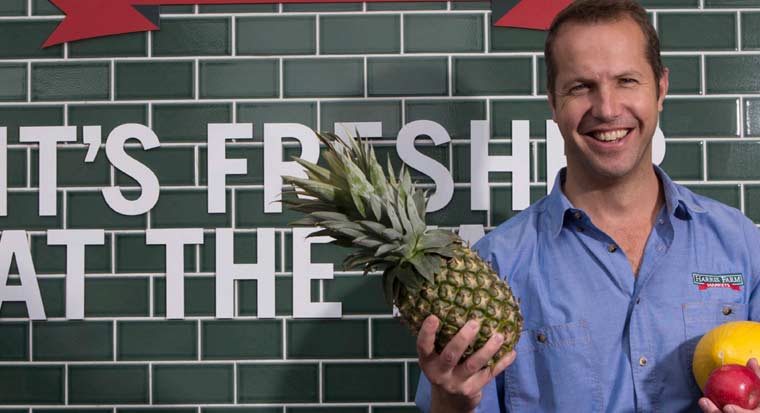 angus harris holding a pineapple